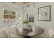 Light-filled breakfast nook with modern decor, windows, and tiled floors at 1307 W Palm Ln, Phoenix, AZ 85007