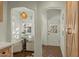 Bright breakfast nook with tiled floors, decorative hanging light, and arched doorways at 1307 W Palm Ln, Phoenix, AZ 85007