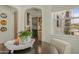 Open concept dining area with arched entryway to updated kitchen at 1307 W Palm Ln, Phoenix, AZ 85007