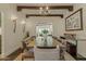 Elegant dining room with wood beam ceilings, comfortable seating, and sophisticated decor for refined entertaining at 1307 W Palm Ln, Phoenix, AZ 85007