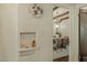 View of dining room with chandelier through arched doorway featuring decorative niche at 1307 W Palm Ln, Phoenix, AZ 85007