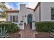 View of the home's charming teal front door, walkway, and landscaped front yard with address display at 1307 W Palm Ln, Phoenix, AZ 85007