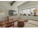 Modern living room featuring tiled floors, a stylish console, and comfortable seating at 1307 W Palm Ln, Phoenix, AZ 85007