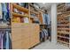 Spacious walk-in closet with custom shelving and storage for clothing and accessories at 1307 W Palm Ln, Phoenix, AZ 85007