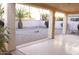 An enclosed backyard area with neutral gravel, minimal desert landscaping, and stucco perimeter wall at 14465 W Winding Trl, Surprise, AZ 85374