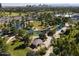 Scenic aerial shot showcasing a pond surrounded by lush greenery and tropical palms at 1610 W Wilshire Dr, Phoenix, AZ 85007