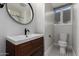 Cozy bathroom with tiled floors, a modern vanity, and neutral walls at 1610 W Wilshire Dr, Phoenix, AZ 85007