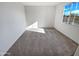 Sunny bedroom with a window and carpet, offering a bright and inviting space at 16416 W Cottontail Ln, Surprise, AZ 85387