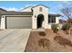 Charming single-story home with a well-manicured front yard and a two-car garage at 16416 W Cottontail Ln, Surprise, AZ 85387