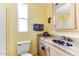 Cozy bathroom with decorative granite countertop and sink, and a bright sunny window at 17200 W Bell Rd # 26, Surprise, AZ 85374