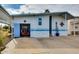 Attached blue garage with the door open showing a golf cart parked inside the house at 17200 W Bell Rd # 26, Surprise, AZ 85374