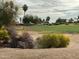 Scenic view of a golf course with desert landscaping in the foreground at 17200 W Bell Rd # 26, Surprise, AZ 85374