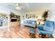 Cozy living room featuring light-colored walls, hardwood floors, and a comfortable seating arrangement at 17200 W Bell Rd # 26, Surprise, AZ 85374