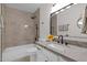 Bathroom featuring modern fixtures, granite countertop, updated vanity, and stylish tiled shower at 1725 N Date -- # 23, Mesa, AZ 85201