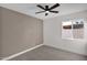 Bedroom featuring neutral carpet, a modern ceiling fan, and a window providing natural light at 1725 N Date -- # 23, Mesa, AZ 85201