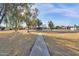 Green community park with mature trees, a walking path, and picnic gazebo at 1725 N Date -- # 23, Mesa, AZ 85201