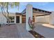 Exterior shot of the home showing a gated carport and front entrance at 1725 N Date -- # 23, Mesa, AZ 85201