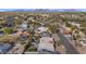 Suburban aerial view showcasing a mature neighborhood with lush trees, community parks, and mountain views at 17309 E Rosita Dr, Fountain Hills, AZ 85268