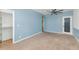 Bright bedroom with carpet, light blue walls, a closet and ceiling fan at 17309 E Rosita Dr, Fountain Hills, AZ 85268