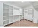 Walk-in closet showcasing custom shelving and storage solutions at 17309 E Rosita Dr, Fountain Hills, AZ 85268