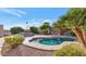 Relaxing backyard pool surrounded by desert landscaping and a built-in barbeque area at 17309 E Rosita Dr, Fountain Hills, AZ 85268