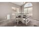 Dining area with modern table and chairs, plus large windows at 1865 E Pinto Dr, Gilbert, AZ 85296