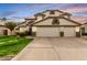 Charming two-story home featuring a three-car garage and well-maintained front yard at 1865 E Pinto Dr, Gilbert, AZ 85296