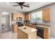 Light wood cabinets, kitchen island, stainless appliances, and open concept design at 1865 E Pinto Dr, Gilbert, AZ 85296