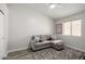 Cozy living room showcasing wood floors, a ceiling fan, and comfortable seating at 1865 E Pinto Dr, Gilbert, AZ 85296