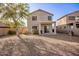 Backyard featuring a covered patio and desert landscaping at 21487 N Greenway Rd, Maricopa, AZ 85138