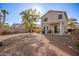 Backyard featuring a covered patio and desert landscaping at 21487 N Greenway Rd, Maricopa, AZ 85138