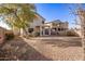 Backyard featuring a covered patio and desert landscaping at 21487 N Greenway Rd, Maricopa, AZ 85138