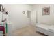 Simple bedroom with a white single bed and decor at 21487 N Greenway Rd, Maricopa, AZ 85138