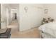 Cozy bedroom with hallway view, featuring light colored carpet, offering a comfortable and private space at 21487 N Greenway Rd, Maricopa, AZ 85138