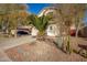 Two-story home with desert landscaping and a blue sky at 21487 N Greenway Rd, Maricopa, AZ 85138