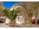 Two-story home with desert landscaping and a blue sky at 21487 N Greenway Rd, Maricopa, AZ 85138