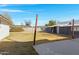 This backyard features a combination of lawn and hardscape, providing a balanced outdoor living space at 215 N Hobson --, Mesa, AZ 85203