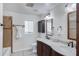 Bathroom featuring dual sinks, tile floor, and a shower/tub combo at 215 N Hobson --, Mesa, AZ 85203