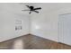 Neutral bedroom with hardwood floors, a ceiling fan, and a bright window at 215 N Hobson --, Mesa, AZ 85203