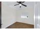 Empty bedroom with a ceiling fan and dark wood floor at 215 N Hobson --, Mesa, AZ 85203