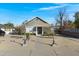 Charming grey home with manicured front yard and inviting entrance, enhancing curb appeal at 215 N Hobson --, Mesa, AZ 85203