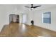 Bright living room featuring hardwood floors, a ceiling fan, and ample natural light at 215 N Hobson --, Mesa, AZ 85203