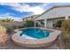 Inviting pool and lush backyard with manicured landscaping and privacy at 21919 N Bradford Dr, Maricopa, AZ 85138