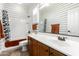 Stylishly decorated bathroom with a single sink vanity and shower-tub combo at 21919 N Bradford Dr, Maricopa, AZ 85138