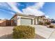 A single-story house with a two-car garage and desert landscaping at 21919 N Bradford Dr, Maricopa, AZ 85138