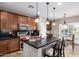 Kitchen featuring stainless steel appliances, granite countertops, and wood cabinets at 21919 N Bradford Dr, Maricopa, AZ 85138