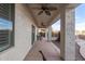 Covered patio offering a relaxing outdoor space with ceiling fans and views of the pool at 21919 N Bradford Dr, Maricopa, AZ 85138