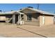 Exterior showcasing the architecture of the home and simple desert landscaping at 2201 N 35Th Dr, Phoenix, AZ 85009