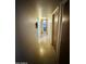 Hallway with tile floors leading to rooms, featuring neutral walls and functional design elements at 2201 N 35Th Dr, Phoenix, AZ 85009