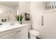 Well-lit bathroom featuring white cabinets, a neutral color scheme, and modern fixtures at 2205 E Linda Ct, Phoenix, AZ 85022